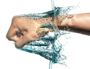 hand punching through water